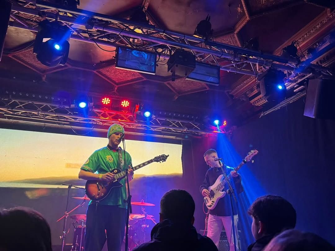 MISE performing live with band under stage lights